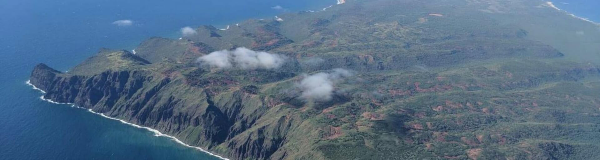 An aerial view of a lush, green island