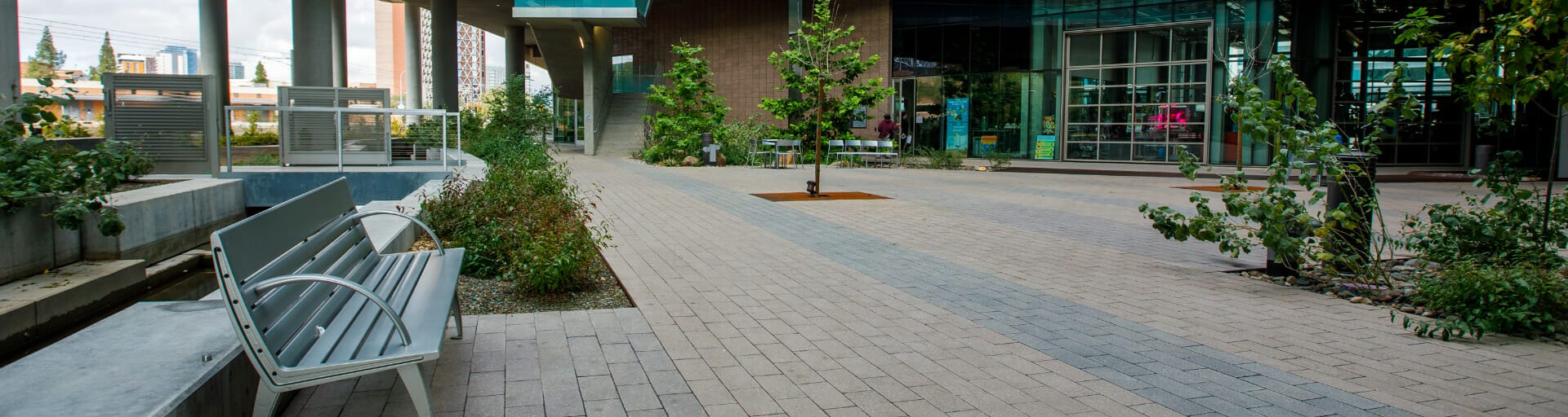 Patio entrance showing plants and bench seating.